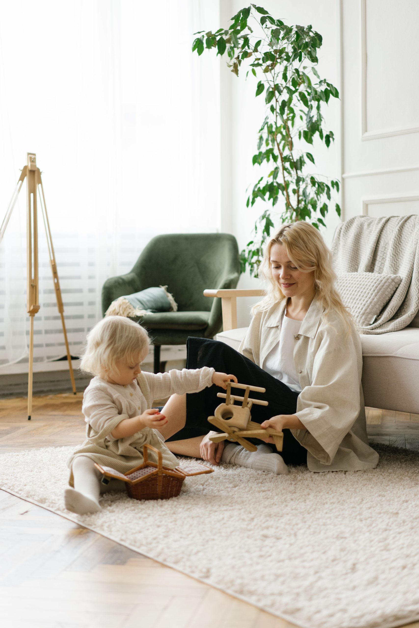Mother and child playing together on a carpet
