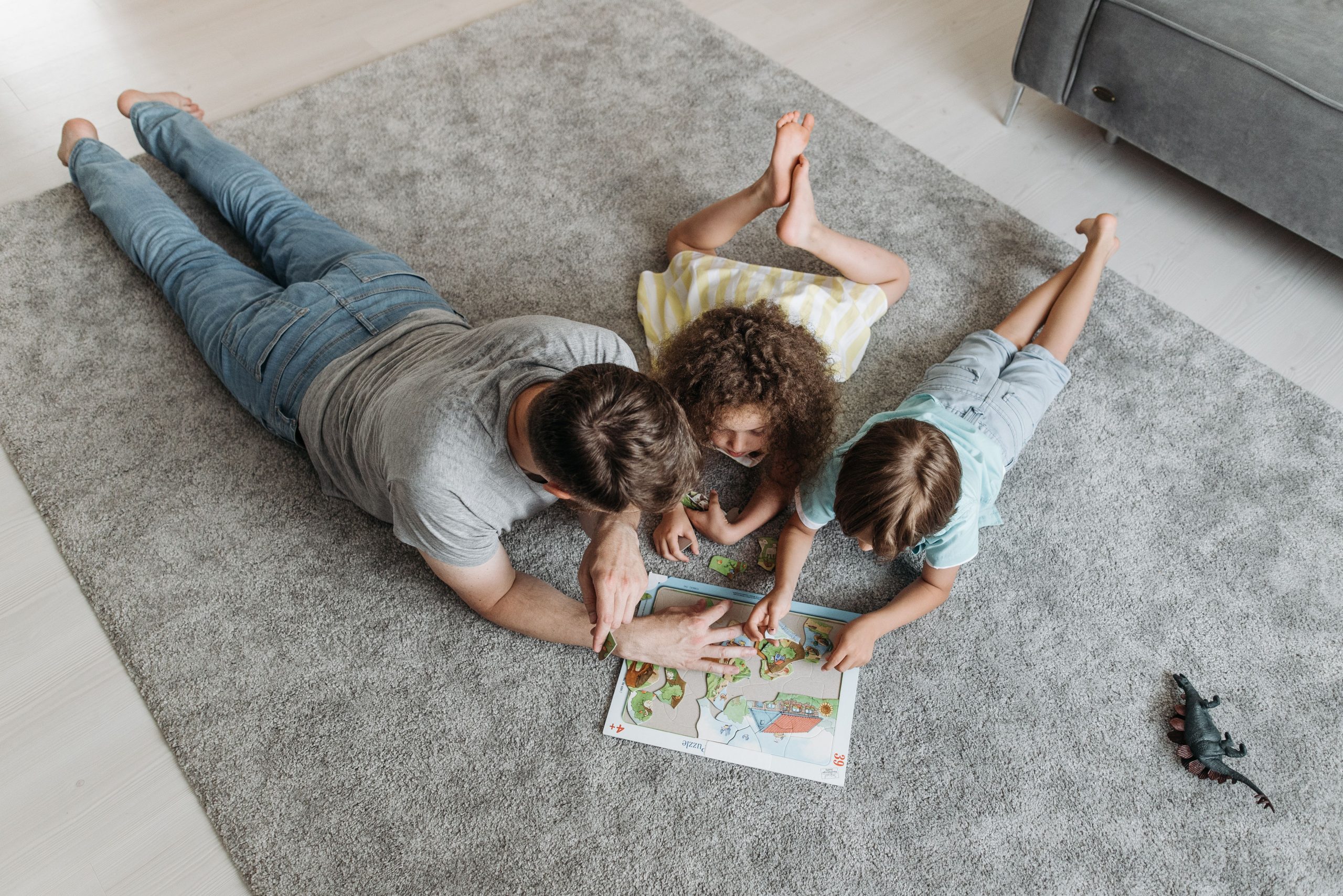 Family relaxing together on a carpet